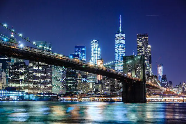 photography of bridge during night time