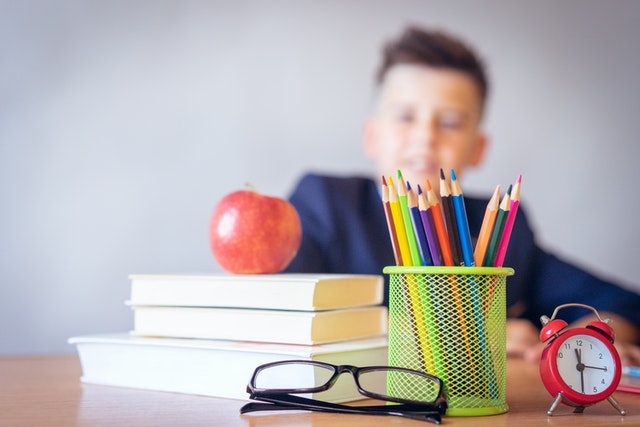 boy looking at a desk