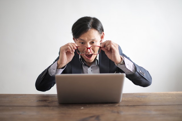 pexels-amazed man looking at laptop screen