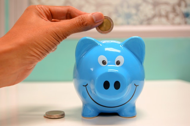 Putting Coin in a Piggy Bank