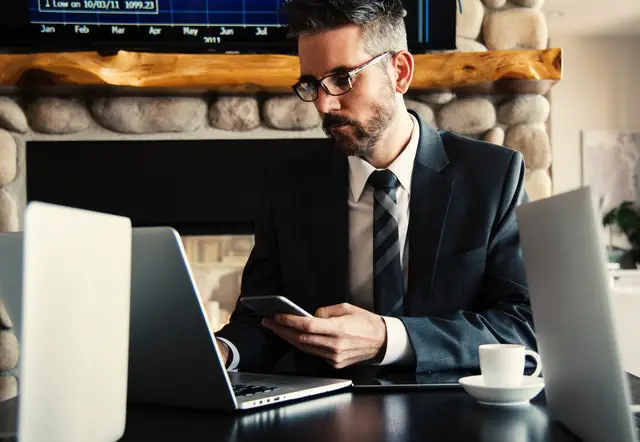 pexels man-in-black-holding-phone