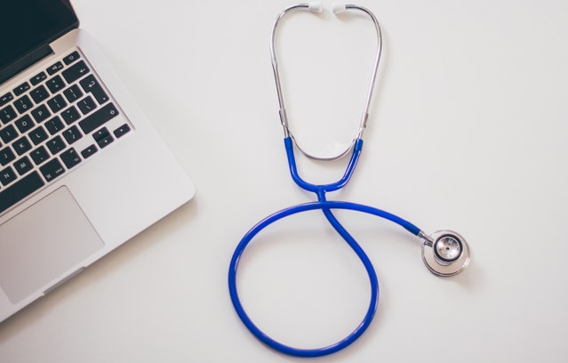 Pexels- Blue and Gray Stethoscope with a laptop