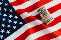 pexels-american flag with rolled dollar bill
