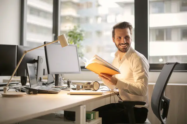 pexels-man holding a book