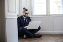 pexels-man using macbook while sitting down
