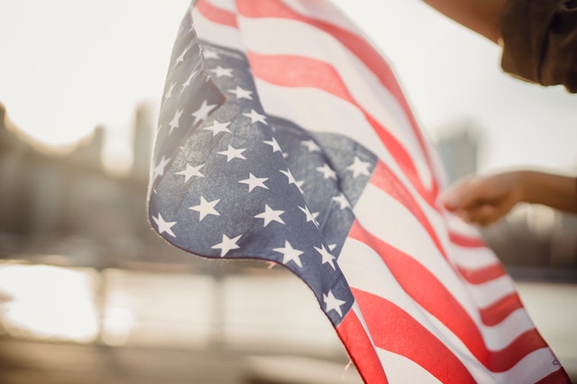 person holding American flag