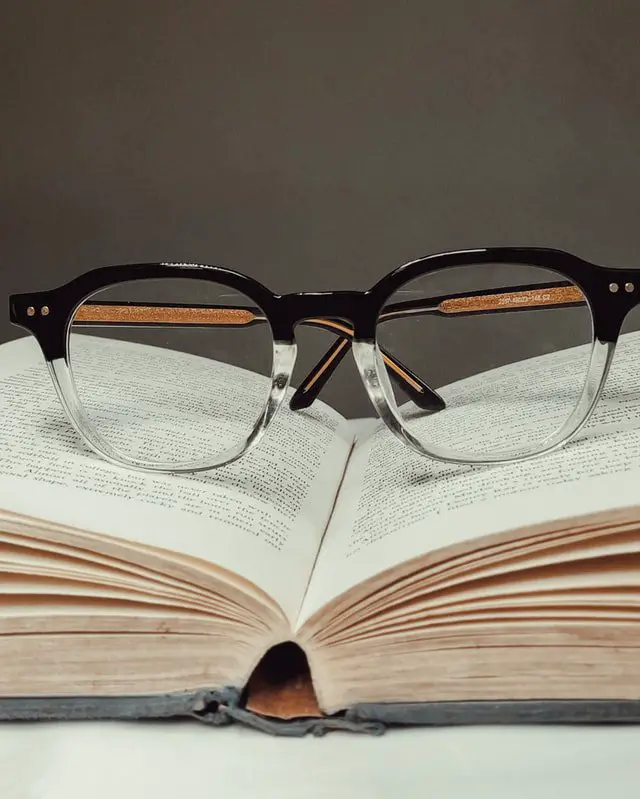 Book and glasses on a table