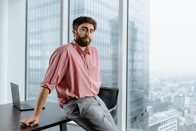 A man in pink button up shirt