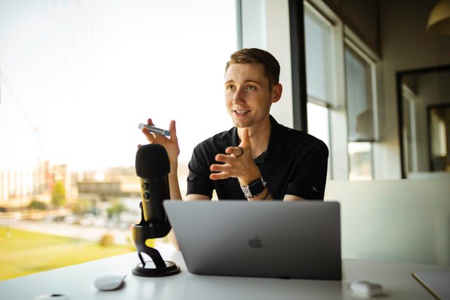 A man in front of a computer