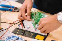 man fixing wire