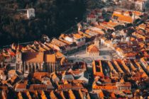 Pexels - An Aerial View of Casa Sfatului Surrounded by City Buildings in Brasov, Romania