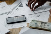 Pexels - Smartphone, Calculator and dollar bill on the table