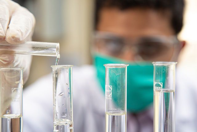 Man working with vials on lab