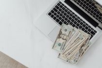 pexels - laptop and money beside it