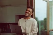 Unsplash - A man smiling so hard