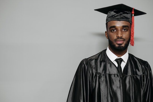 Pexels - Photo of Man Wearing Black Graduation Gown