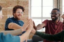 Group of People Joining Hands