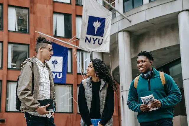 Pexels - Multiethnic students standing near university together