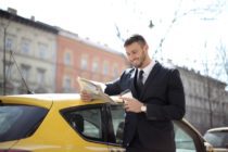 Pexels - Man In Black Suit Holding Newspaper