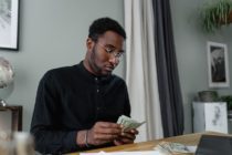 Pexels - A Man Counting Money