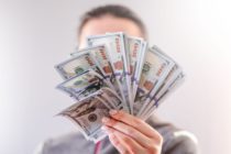 Pexels - A Person Holding Dollar Bills