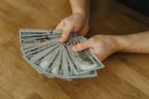 Pexels - Photo of Person Holding Dollar Bills