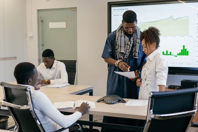 Man and a Woman Discussing a Document