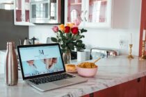 Open Laptop and Food on the Kitchen Counter