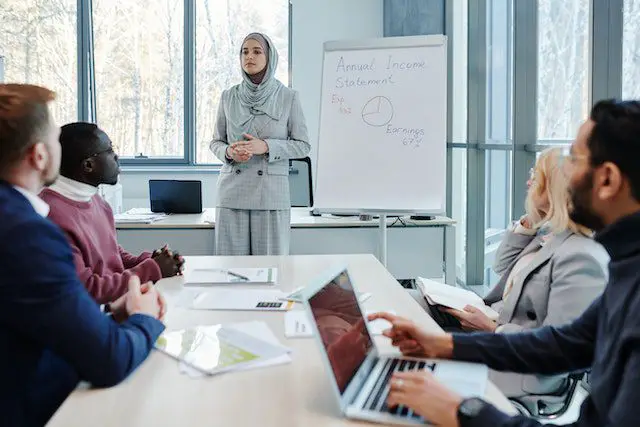 Pexels - A woman doing a business presentation at her workplace