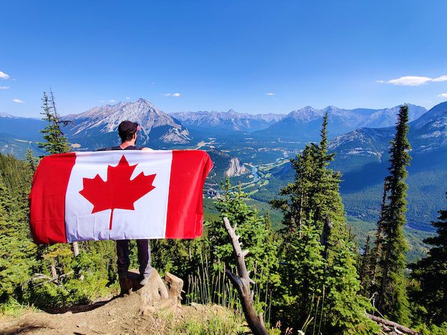 A man holding canada flag