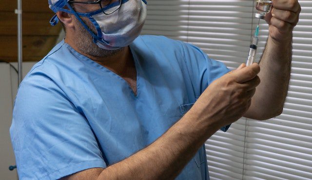 Man In Blue Scrubs