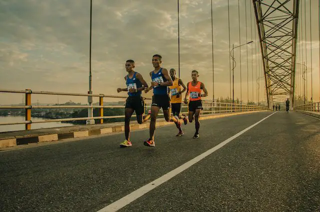 Young men running a race