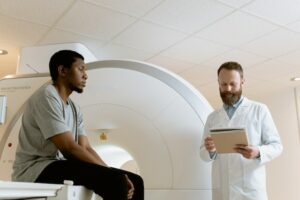 Photo Of Medical Practitioner Looking Through Patient's Records