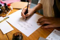 A Calligrapher Writing on a Paper