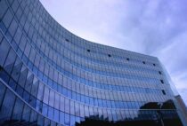 Pexels - Fish Eye View Photo of Glass High Story Building over White Cloudy Sky during Daytime