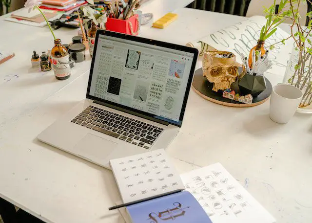 Pexels - Silver Laptop on White Wooden Table