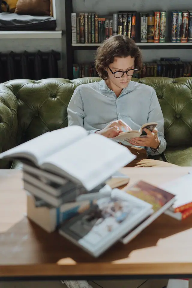 Pexels- Student Reading Books at the Library