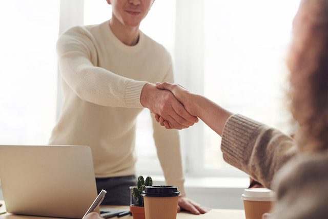Pexels - two people shaking hands