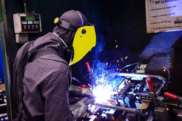 Person Welding Metal