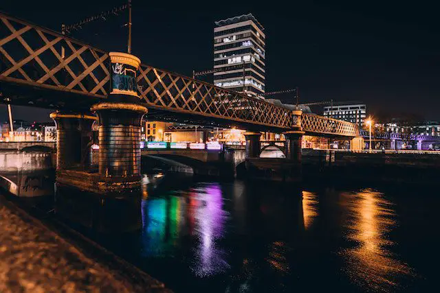 https://www.pexels.com/photo/architectural-photo-of-brown-concrete-bridge-and-high-rise-building-during-night-time-842970/