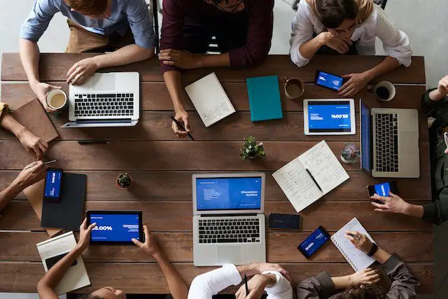 top view photo of people near wooden table