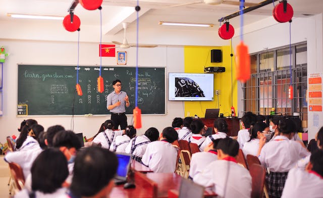 teacher with learners in classroom