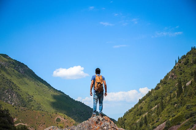 man on top of mountain