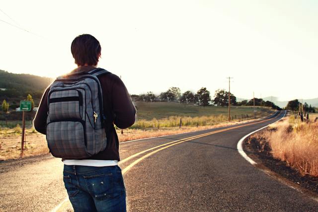 man facing road