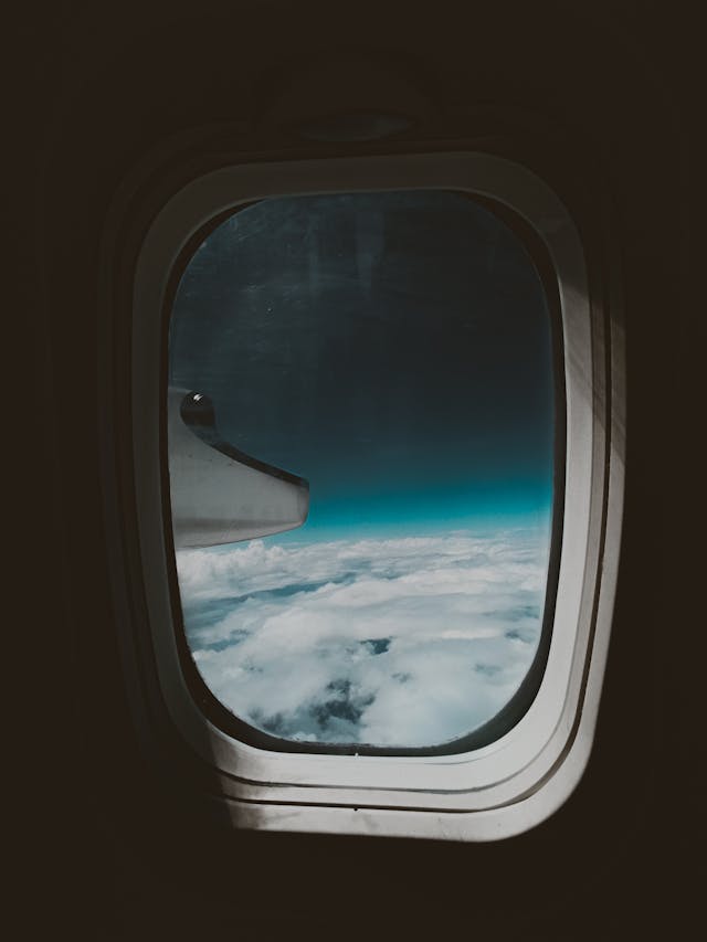 clouds and blue sky from aircraft illuminator