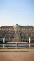 a large building with a fountain in front of it