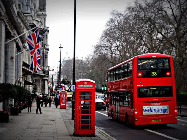 selective photo of 2 deck bus near people