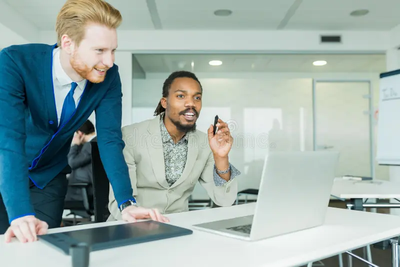 men in the office discussing