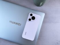 a white phone next to a laptop