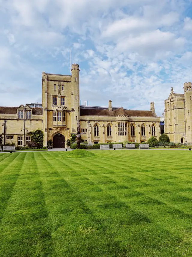 historic university building with green lawn